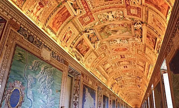 The Gallery of Maps with painted maps of Italy on the walls under a gilded vaulted ceiling